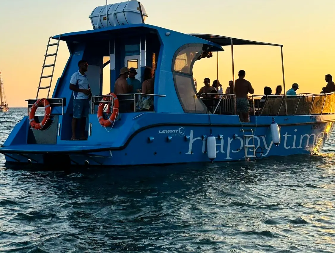 Passengers relaxing on the Benagil Caves catamaran tour from Lagos