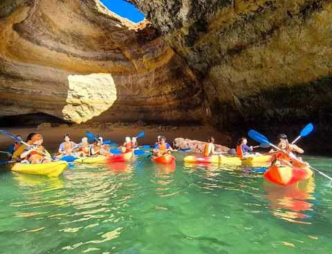 Kayakers paddling inside Algar de Benagil on the guided kayak tour