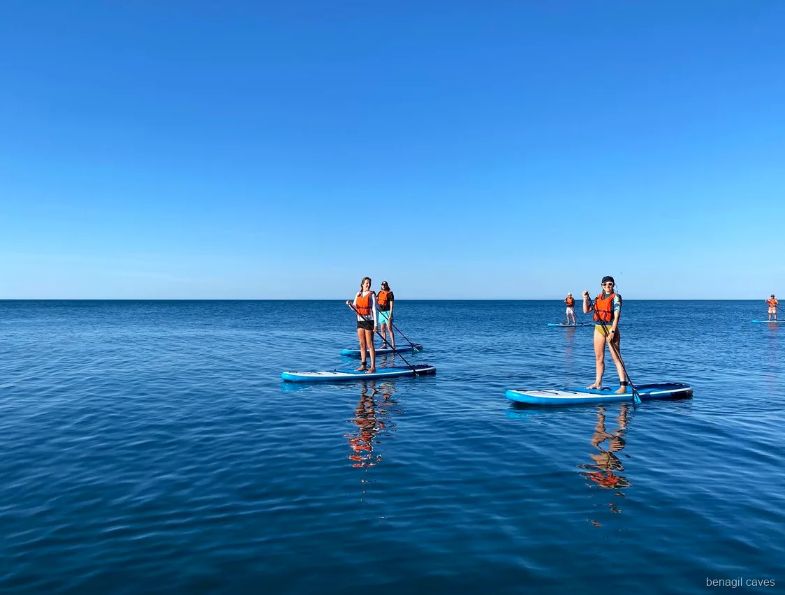 Paddleboards resting on the sand near Benagil during the SUP tour