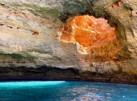 Golden skylight inside Algar de Benagil seen from the speedboat tour